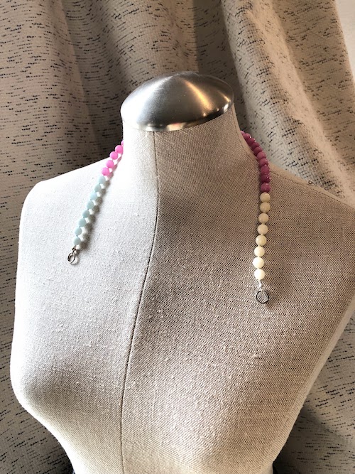 Open loop. Blue, pink, and yellow beads, hand knotted on white silk