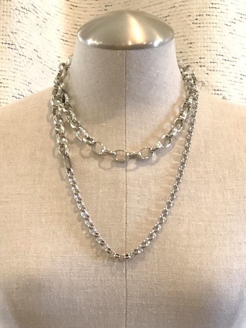 Heavy silver plated necklace with two antiqued brass links.