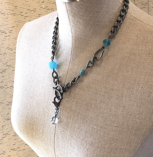 Gunmetal, thick curb chain. Large toggle clasp to wear in front or back. Comes with a dainty removable dangle.