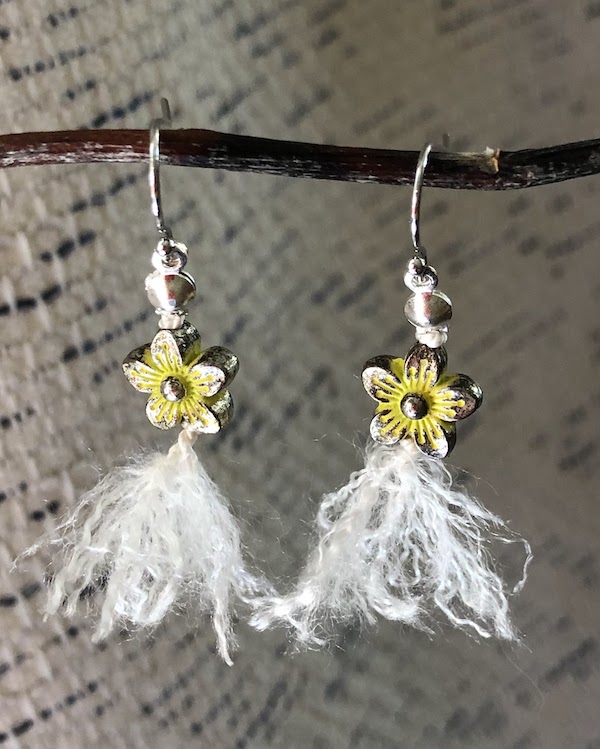 Yellow metal flower beads knotted on 100% white silk and fluffed out!