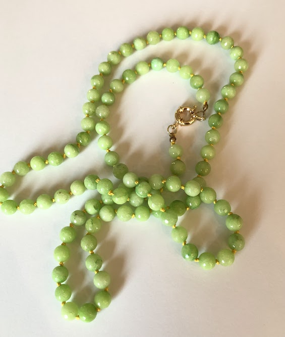 Lime green, faceted jade gemstone necklace, hand knotted on true yellow silk and finished with gold clasp.